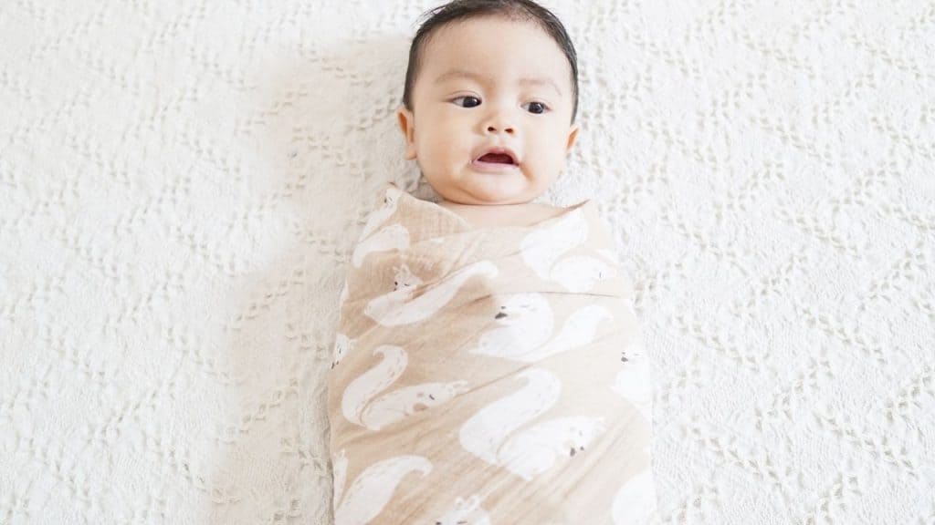 stop swaddling when baby rolls from tummy to back