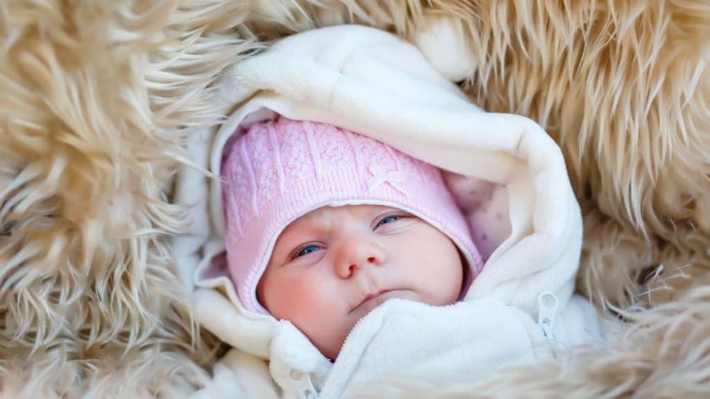 A cozy baby in bed