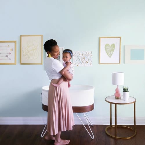 mom and baby with snoo smart sleeper rental