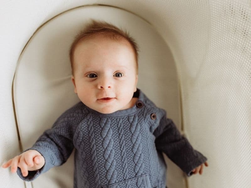 baby resting in a bassinet