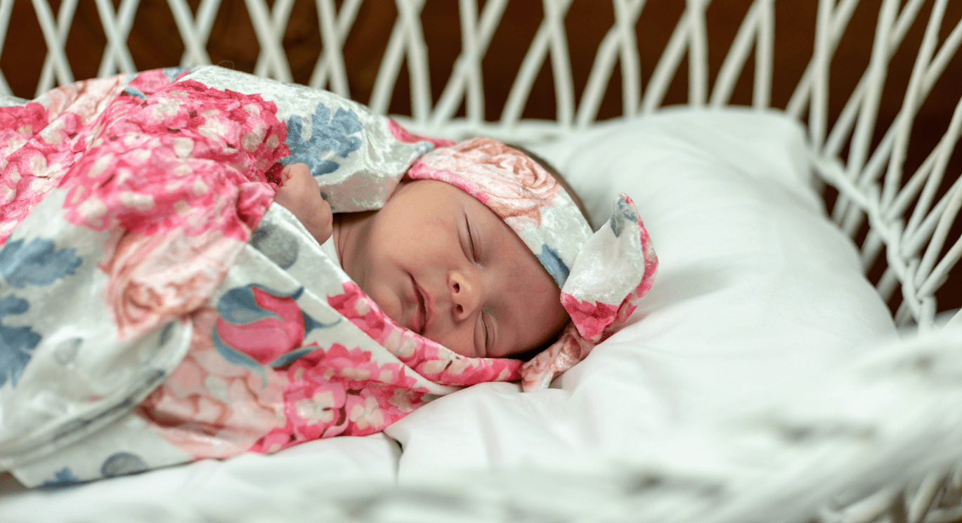 Newborn Sleeping In a Swaddle